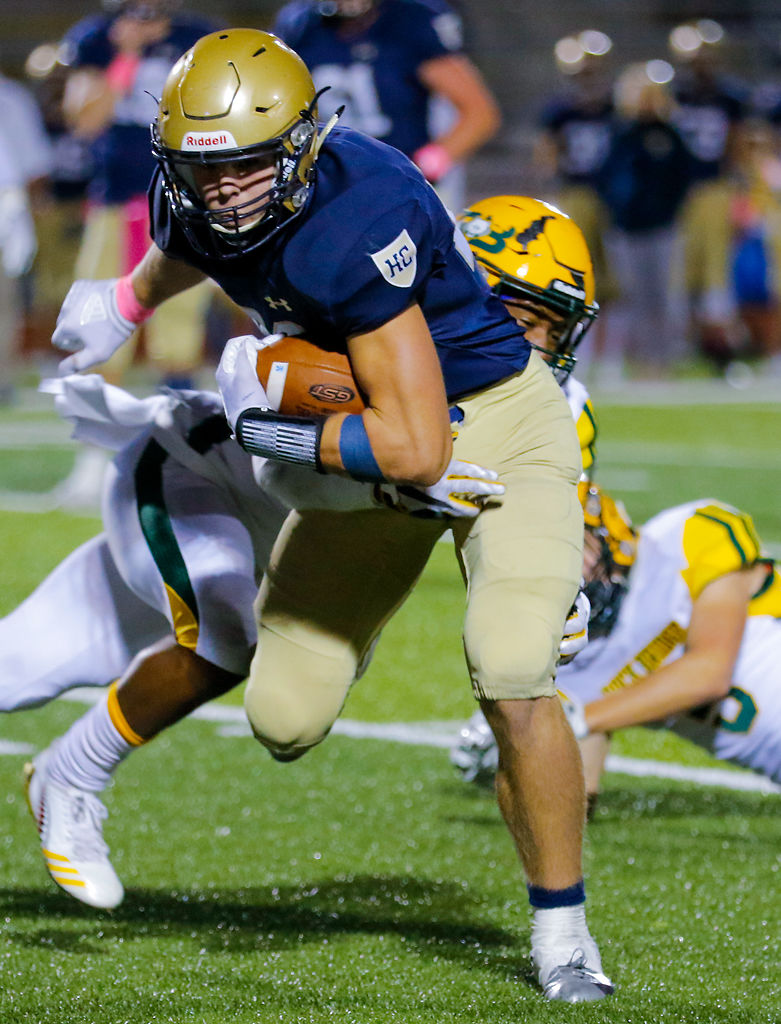 Jake Warren evades Rock Bridge free safety Tre Manuel